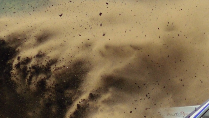 Eric v Loon-1×1 Rally car 705 Eric van Loon coming around the curve large cloud of dust kicked up behind him grid tile 1