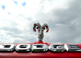 SCP_4 Red Dodge Truck with ram hood ornament and light up eyes. Cloudy overcast sky in the background.